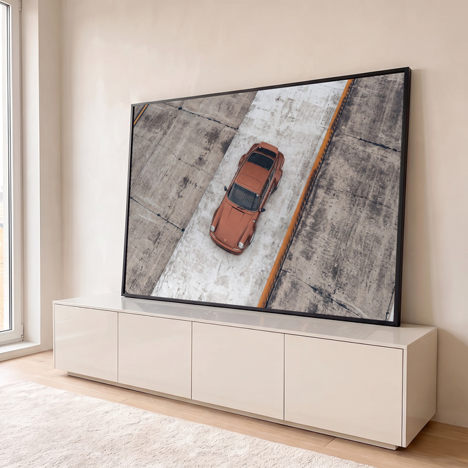 Quadro Decorativo Grande Carro Vista Aérea para Sala Laranja | quadros decorativos para sala | carro esportivo laranja visto de cima sobre pista de concreto cinza | em Quadros para Sala | Porao dos Quadros