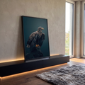 Águia marrom de asas semiabertas pousada em rocha escura sobre fundo azul petróleo, quadro decorativo