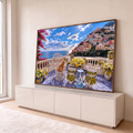 Quadro Decorativo Grande Gato na Varanda para Sala Azul | quadros decorativos para sala | gato ruivo numa cadeira de vime com vista para vila italiana à beira-mar | em Quadros para Sala | Porao dos Quadros