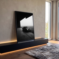 Quadro Decorativo Grande Carro Clássico Preto para Sala | quadros decorativos para sala | carro esportivo clássico preto estacionado na saída de um hangar com neblina ao fundo | em Quadros para Sala | Porao dos Quadros