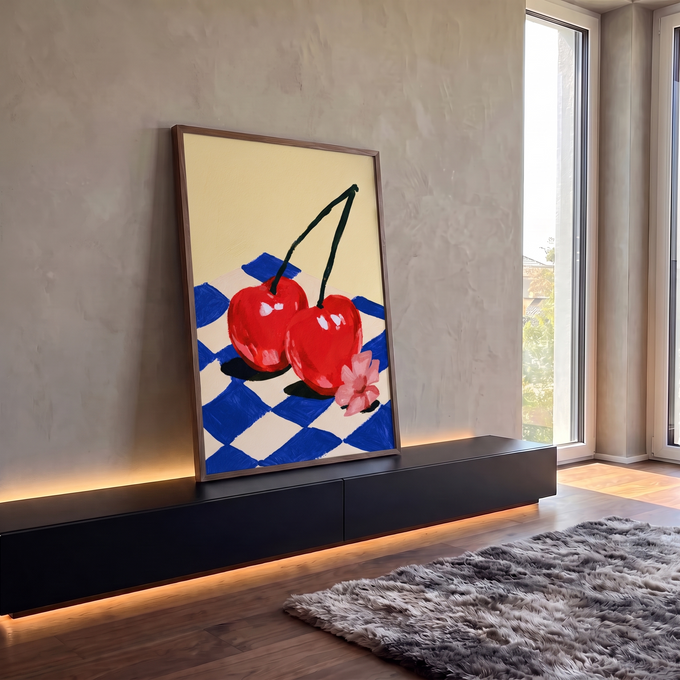 Quadro Decorativo Grande Cerejas Vermelhas para Área Gourmet | quadros decorativos para sala | duas cerejas vermelhas unidas sobre tecido xadrez azul e flor rosa | em Quadros para Área Gourmet | Porao dos Quadros