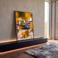 Quadro Decorativo Grande Carro Preto para Sala Cinza | quadros decorativos para sala | carro esportivo cinza escuro visto através de folhas amarelas ao pôr do sol | em Quadros para Sala | Porao dos Quadros