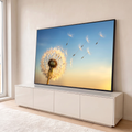 Dente de leão iluminado soltando sementes ao vento em céu azul e dourado ao entardecer, quadro decorativo