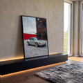 Quadro Decorativo Grande Carro Esportivo para Sala Cinza | quadros decorativos para sala | carro esportivo clássico cinza em rua de paralelepípedos com prédio de tijolos ao fundo | em Quadros para Sala | Porao dos Quadros