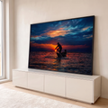 Quadro Decorativo Grande Pescador ao Pôr do Sol para Sala | quadros decorativos para sala | pescador em silhueta puxando rede ao pôr do sol com céu laranja e azul | em Quadros para Sala | Porao dos Quadros