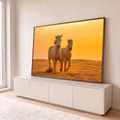 Quadro Decorativo Grande Cavalos Caminhando para Sala | quadros decorativos para sala | dois cavalos cor de areia caminhando no deserto sob céu laranja de pôr do sol | em Quadros para Sala | Porao dos Quadros