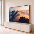 Quadro Decorativo Grande Picos de Montanha para Sala Laranja | quadros decorativos para sala | picos de montanha escuros emergindo de nuvens com céu laranja ao pôr do sol | em Quadros para Sala | Porao dos Quadros