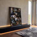 Quadro Decorativo Lobo de Olhos Dourados na Floresta | quadros decorativos para sala | close-up de lobo com olhos amarelo-esverdeados e pelagem em tons de cinza e dourado | em Quadros para Sala | Porao dos Quadros