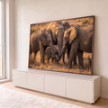 Quadro Decorativo Grande Elefantes Protegendo para Sala | quadros decorativos para sala | elefantes adultos formando círculo protetor ao redor de filhote com tromban entrelaçadas | em Quadros para Sala | Porao dos Quadros