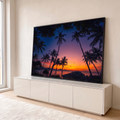 Quadro Decorativo Grande Pôr do Sol Coqueiros para Sala | quadros decorativos para sala | silhuetas de coqueiros contra pôr do sol colorido sobre o mar e montanhas | em Quadros para Sala | Porao dos Quadros