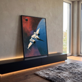 Quadro Decorativo Nave Espacial Branca sobre Planeta Azul | quadros decorativos para sala | nave espacial branca sobrevoando planeta azul sob céu vermelho e laranja | em Quadros para Sala | Porao dos Quadros
