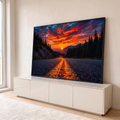 Quadro Decorativo Grande Estrada na Floresta para Sala | quadros decorativos para sala | estrada entre pinheiros com pôr do sol laranja e montanhas ao fundo | em Quadros para Sala | Porao dos Quadros