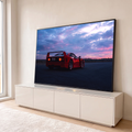 Ferrari F40 vermelha de traseira, lanternas acesas, em pista sob céu roxo e rosa ao entardecer, quadro decorativo