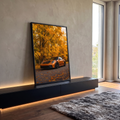 Quadro Decorativo Grande Carro Esportivo para Sala Laranja | quadros decorativos para sala | carro esportivo laranja estacionado em estrada cercada por árvores de outono douradas | em Quadros para Sala | Porao dos Quadros