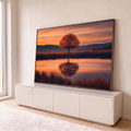 Árvore de outono solitária refletida em lago calmo sob céu laranja de pôr do sol, quadro decorativo