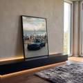 Porsche 911 preto com rodas bronze diante do skyline de Nova York sob céu nublado, quadro decorativo