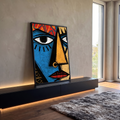 Quadro Decorativo Máscara Tribal Azul e Dourada | quadros decorativos para sala | rosto estilizado tribal dividido em azul e dourado com olhos grandes e boca vermelha | em Quadros para Sala | Porao dos Quadros