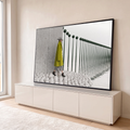 Quadro Decorativo Grande Mulher de Casaco para Sala Verde | quadros decorativos para sala | mulher de casaco verde e chapéu cônico caminhando sobre pedras brancas junto a postes refletidos na água | em Quadros para Sala | Porao dos Quadros