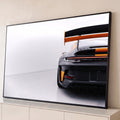 Quadro Decorativo Grande Carro Laranja para Sala Preto | quadros decorativos para sala | traseira de carro esportivo preto fosco com detalhes laranja e aerofólio em estúdio | Porao dos Quadros