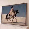 Quadro Decorativo Grande Guerreiro Indígena para Sala Azul | quadros decorativos para sala | guerreiro indígena de perfil montado em cavalo preto e branco sob céu azul | Porao dos Quadros