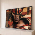 Quadro Decorativo Mãe e Filho com Pintura Facial Africana | quadros decorativos para sala | mulher com rosto pintado em preto e vermelho segurando bebê adormecido no ombro | Porao dos Quadros