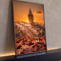 Folha de outono com gotas de chuva, gota refletindo torre ao pôr do sol laranja, quadro decorativo