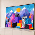 Quadro Decorativo Grande Cidade Geométrica para Sala Rosa | quadros decorativos para sala | cidade de blocos geométricos coloridos com padrões gráficos e montanhas ao fundo | Porao dos Quadros