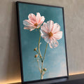 Quadro Decorativo Flores Cosmos Rosa em Fundo Azul Petróleo | quadros decorativos para sala | duas flores cosmos rosa e branca com centro amarelo sobre fundo azul petróleo | Porao dos Quadros