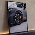 Quadro Decorativo Grande Carro Esportivo para Sala Cinza | quadros decorativos para sala | close de carro esportivo cinza fosco com roda preta e pinça de freio amarela | Porao dos Quadros