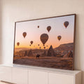 Quadro Decorativo Grande Balões a Capadócia para Sala | quadros decorativos para sala | balões de ar quente coloridos sobre a Capadócia ao pôr do sol, com cavaleiro em silhueta | Porao dos Quadros
