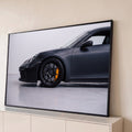 Quadro Decorativo Grande Carro Preto Fosco para Sala Preto | quadros decorativos para sala | carro esportivo preto fosco com pinça de freio amarela e roda em destaque | Porao dos Quadros