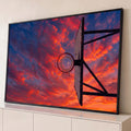 Quadro Decorativo Grande Cesta de Basquete para Sala Laranja | quadros decorativos para sala | cesta de basquete vista de baixo contra céu de pôr do sol com lua visível no aro | Porao dos Quadros