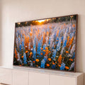 Quadro Decorativo Grande Campo de Flores para Sala Azul | quadros decorativos para sala | campo de flores azuis e laranjas com luz dourada do pôr do sol ao fundo | Porao dos Quadros