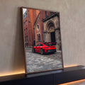 Quadro Decorativo Grande Esportivo para Sala | quadros decorativos para sala | carro esportivo vermelho com aerofólio em rua de paralelepípedos frente a igreja de tijolos | Porao dos Quadros
