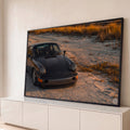 Quadro Decorativo Grande Carro Esportivo Praia para Sala | quadros decorativos para sala | carro esportivo cinza-escuro em dunas de areia sob luz dourada de pôr do sol | Porao dos Quadros