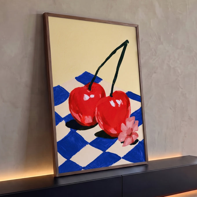 Quadro Decorativo Grande Cerejas Vermelhas para Área Gourmet | quadros decorativos para sala | duas cerejas vermelhas unidas sobre tecido xadrez azul e flor rosa | Porao dos Quadros