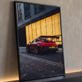 Porsche 911 GT3 RS vermelho de traseira em rua urbana com fachada dourada iluminada, quadro decorativo