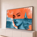 Rosto de mulher dividido em laranja e azul fundido ao mar com onda e catamarã, quadro decorativo