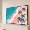 Quadro Decorativo Grande Praia Tropical Azul para Sala | quadros decorativos para sala | vista aérea de praia com mar turquesa, ondas e silhuetas de coqueiros sobre areia rosa | Porao dos Quadros