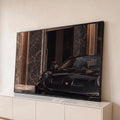 Quadro Decorativo Grande Filhote de Pantera para Sala Preto | quadros decorativos para sala | filhote de pantera negra apoiado no capô de um carro esportivo preto | Porao dos Quadros