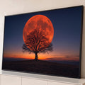 Quadro Decorativo Grande Lua Vermelha Laranja para Sala | quadros decorativos para sala | lua vermelha gigante atrás de árvore seca silhueta ao entardecer | Porao dos Quadros