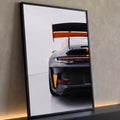 Quadro Decorativo Grande Carro Esportivo para Sala Preto | quadros decorativos para sala | traseira de carro esportivo preto fosco com detalhes laranja e aerofólio em destaque | Porao dos Quadros