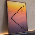 Galho seco em silhueta refletido em água calma sob céu laranja, rosa e lilás, quadro decorativo