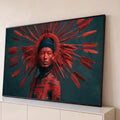Mulher com cocar de penas vermelhas e pintura facial tribal sobre fundo escuro, quadro decorativo
