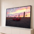 Ferrari F40 vermelha no asfalto com marcas de pneu sob céu rosa de pôr do sol e palmeiras, quadro decorativo
