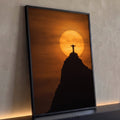 Silhueta do Cristo Redentor no Corcovado diante de um sol laranja gigante, quadro decorativo
