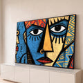 Quadro Decorativo Grande Rosto Cubista Azul para Sala | quadros decorativos para sala | rosto cubista dividido em azul e laranja com padrões tribais coloridos ao fundo | Porao dos Quadros