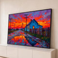 Quadro Decorativo Grande Casa Azul Laranja para Sala | quadros decorativos para sala | casa azul numa estrada molhada refletindo céu de pôr do sol laranja e roxo | Porao dos Quadros