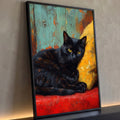 Quadro Decorativo Gato Preto de Olhos Amarelos em Pintura | quadros decorativos para sala | gato preto de olhos amarelos deitado sobre tecido vermelho e almofada amarela | Porao dos Quadros