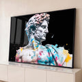 Quadro Decorativo Grande Busto Clássico para Sala Branco | quadros decorativos para sala | busto de mármore clássico coberto de respingos de tinta azul rosa e amarela sobre fundo preto | Porao dos Quadros
